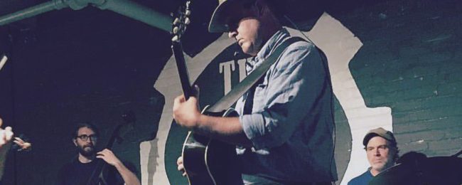 Dave Wilson of Root River Jam playing at The Jive Mill