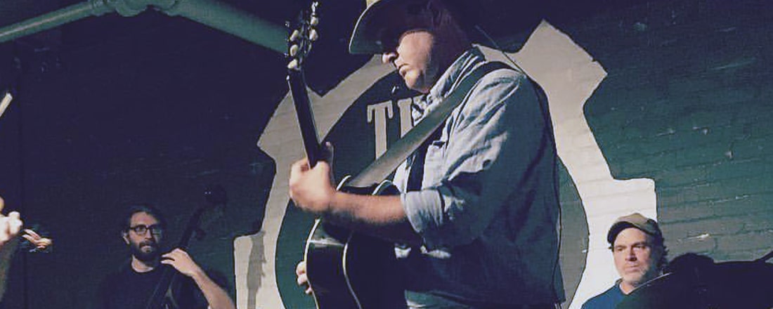 Dave Wilson of Root River Jam playing at The Jive Mill